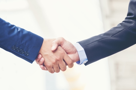 two men shaking hands